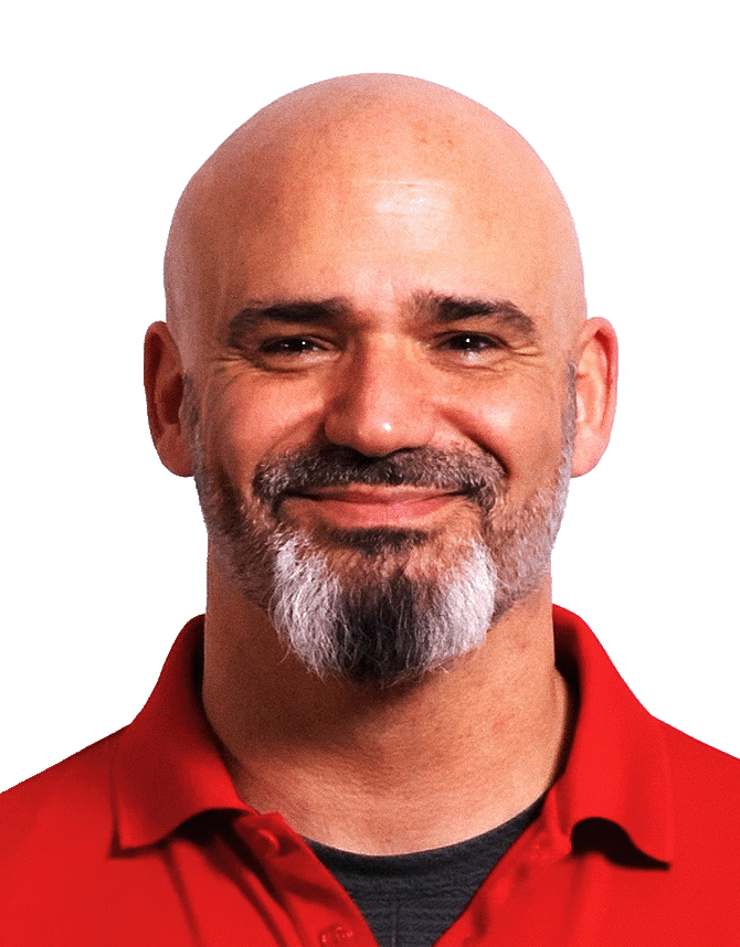 Paul DiRienzo, BAS co-founder, smiling, in a red polo